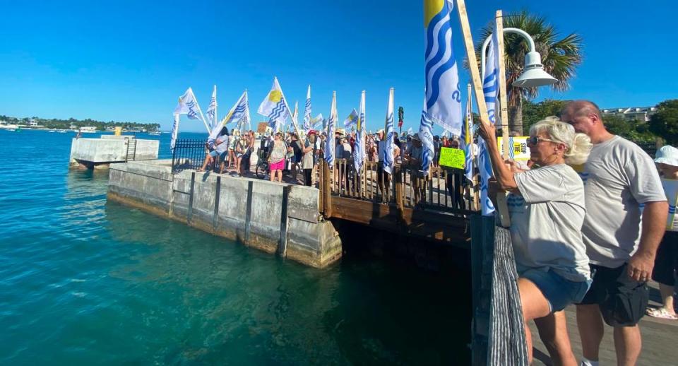 Protesters gathered at Mallory Pier on Dec. 9, 2021, to protest the arrival of a large cruise ship, the Norwegian Dawn.