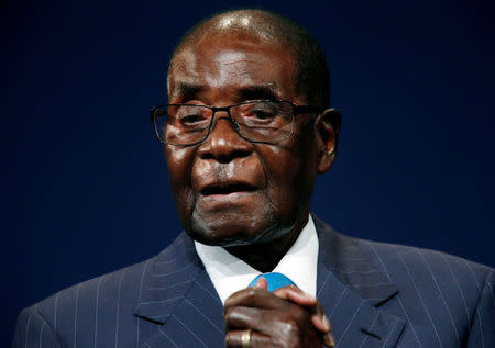 FILE PHOTO - Zimbabwean President Robert Mugabe leaves the stage after participating in a discussion at the World Economic Forum on Africa 2017 meeting in Durban, South Africa May 4, 2017. REUTERS/Rogan Ward/File Photo