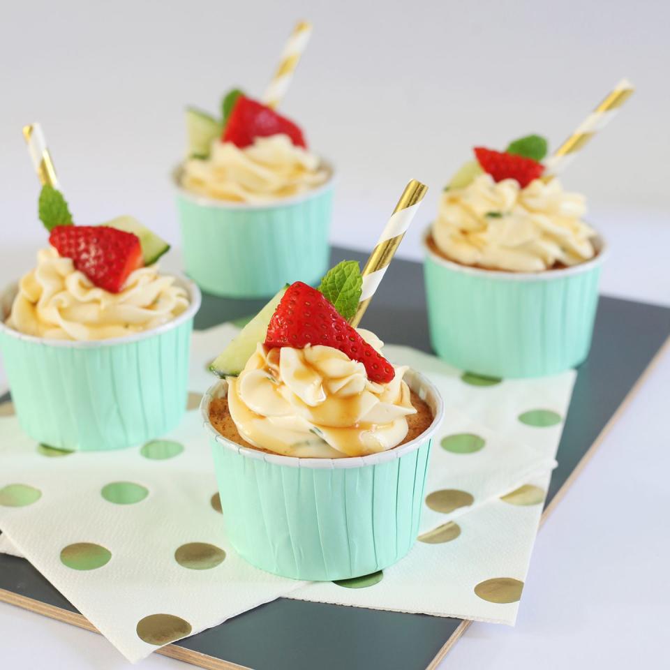 <p>With a citrusy tender sponge, minty cream cheese icing and sticky Pimm's syrup, this Pimm's cupcake recipes is a perfect summer afternoon tea treat.</p><p><strong>Recipe: <a href="https://www.goodhousekeeping.com/uk/food/recipes/pimms-cupcakes" rel="nofollow noopener" target="_blank" data-ylk="slk:Pimm's cupcakes;elm:context_link;itc:0;sec:content-canvas" class="link ">Pimm's cupcakes</a> </strong><br><br></p>