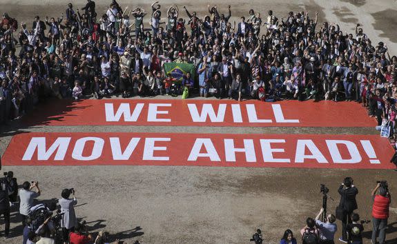 Participants at the COP22 climate conference stage a public show of support for climate negotiations and the Paris agreement in Marrakech, Morocco on Nov. 18, 2016.