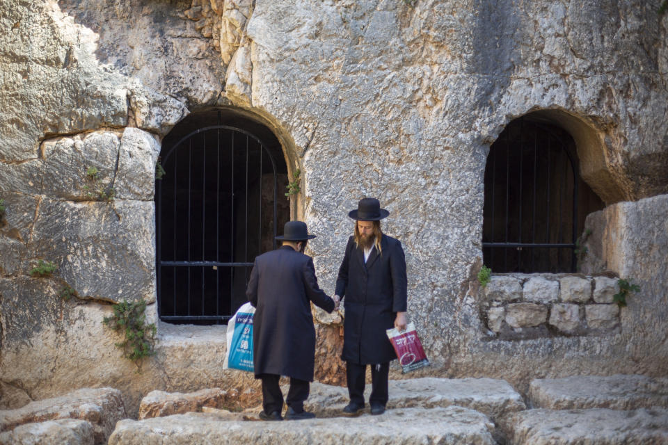 In this Thursday, Oct. 31, 2019 photo, ultra-Orthodox Jews visits the Tomb of the Kings, a large underground burial complex dating to the first century BC, in east Jerusalem neighborhood of Sheikh Jarrah. After several aborted attempts, the French Consulate General has reopened one of Jerusalem's most magnificent ancient tombs to the public for the first time in over a decade, sparking a distinctly Jerusalem conflict over access to an archaeological-cum-holy site in the volatile city's eastern half. (AP Photo/Ariel Schalit)