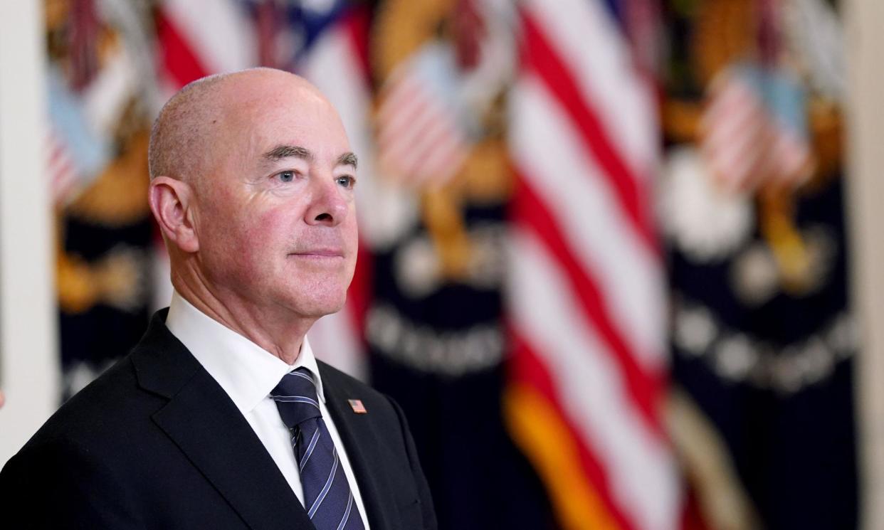 <span>Alejandro Mayorkas in the White House as Joe Biden presents an order to restrict immigration at the southern border, in Washington on Tuesday.</span><span>Photograph: Rex/Shutterstock</span>