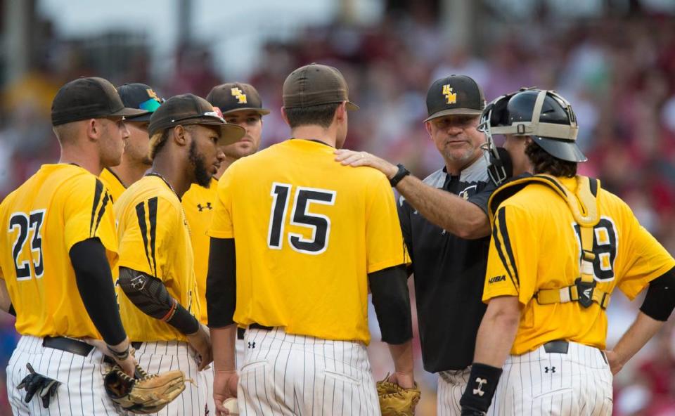 Southern Miss pitching coach Christian Ostrander visits the mound during the team’s NCAA college baseball tournament regional game against Arkansas on Saturday in Fayetteville, N.C.