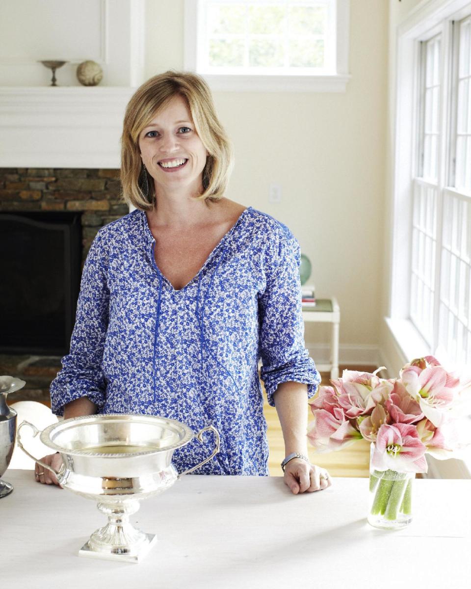 This 2012 photo shows Better Homes & Gardens Senior Editor, Amy Panos, in Saratoga Springs, New York. Like many housekeeping tasks, regular cleaning can help avoid bigger cleanup work later on. “It doesn’t have to be as difficult of a job as it sounds,” said Panos. “The easier you can make it on yourself, the more likely you are to do it.” (AP Photo/Better Homes & Gardens, Kate Mathis)