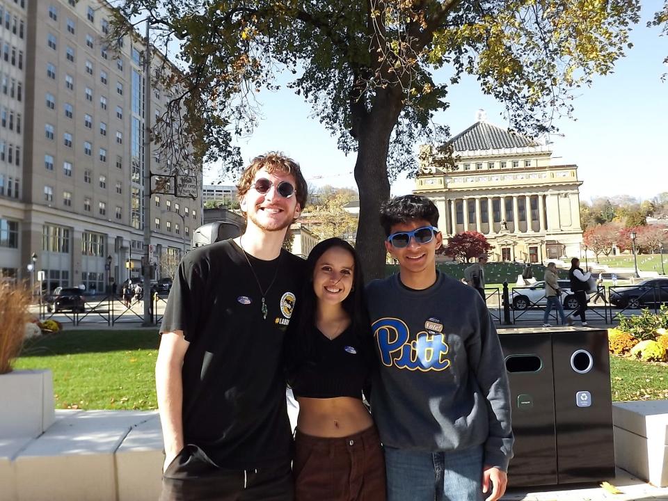 Matt Jurich, Grace Cuevas and Rafay Khan-Afridi (left to right) outside the Pitt Student Union building Tuesday, Nov. 7, 2023.