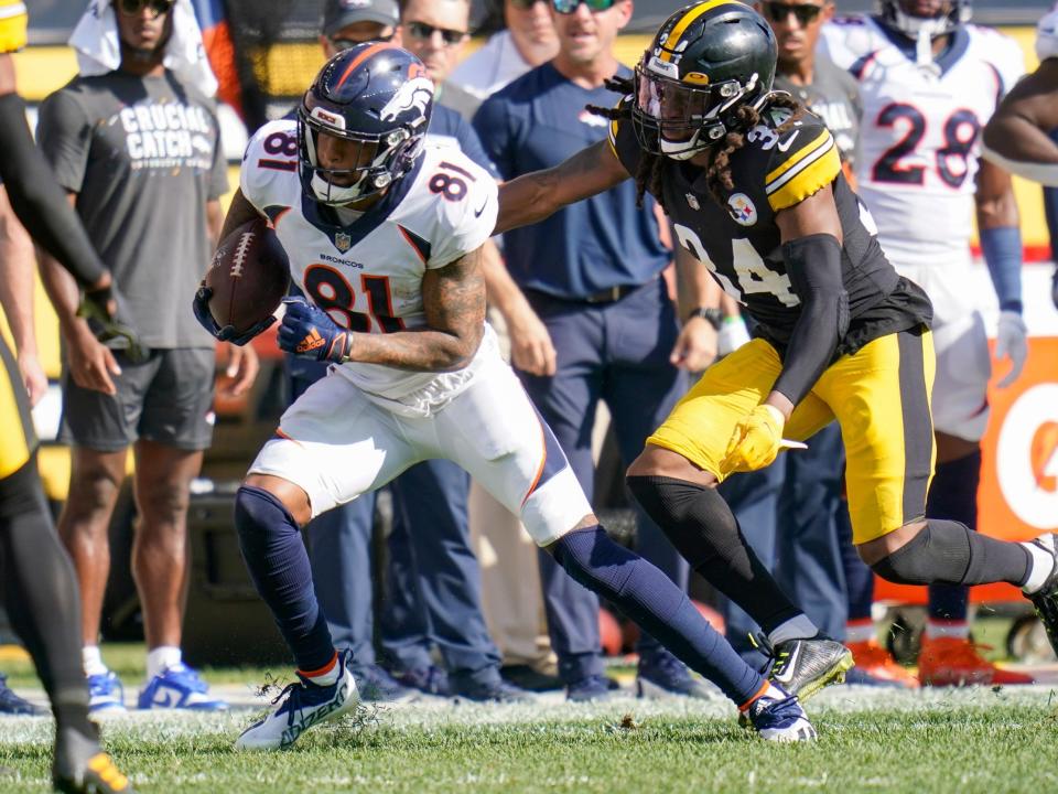 Tim Patrick pushes forward against the Pittsburgh Steelers.