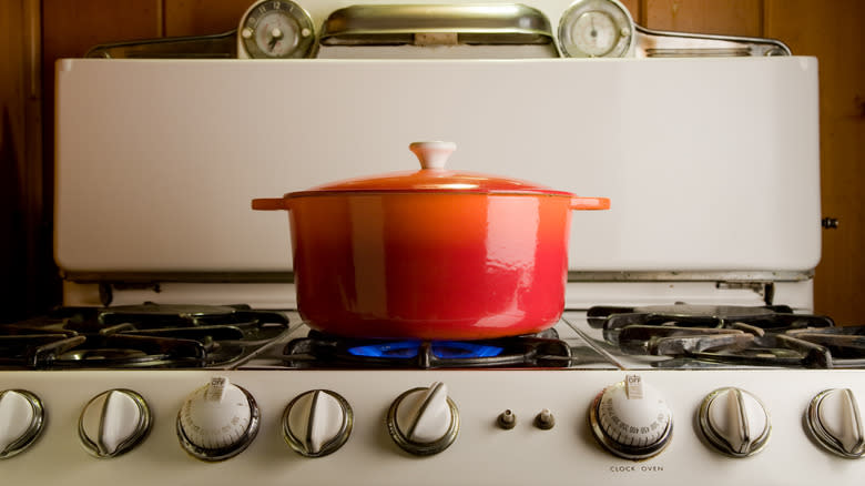 red dutch oven on stove