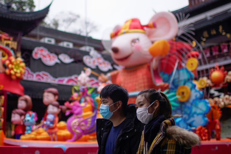 People wear masks at Yuyuan Garden, during the extended Chinese Lunar New Year holiday as the country is hit by an outbreak of the coronavirus, in Shanghai