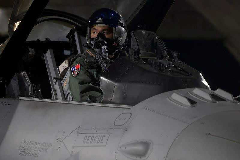 A pilot sits inside a F-16V that landed at the air base in Hualien,