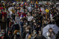 Demonstrators gather during a protest to demand more resources for public health system in Madrid, Spain, Sunday, Nov. 29, 2020. The organizers delivered a manifesto to the Madrid regional authorities demanding the end privatization of the health system. (AP Photo/Bernat Armangue)
