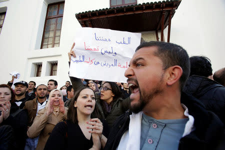 Algerian doctors, who are completing their residency stage of their studies, shout slogan during a sit-in protest in Algiers, Algeria, February 12, 2018. REUTERS/Ramzi Boudina