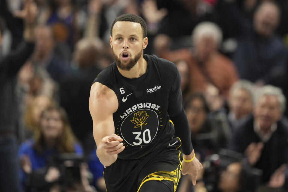 Golden State Warriors guard Stephen Curry gestures after hitting a 3-pointer against the New Orleans Pelicans during the third quarter of an NBA basketball game Tuesday, March 28, 2023, in San Francisco. (AP Photo/Darren Yamashita)