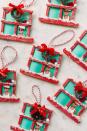 <p>To make these cute DIY ornaments, you'll need five regular popsicle sticks, plus one bigger stick for the bottom. Decorate your creation with a mini wreath, fake snow and a photo of your little one.</p><p><a href="https://studiodiy.com/christmas-window-popsicle-stick-ornament-craft/" rel="nofollow noopener" target="_blank" data-ylk="slk:Get the tutorial at Inspired by Charm »;elm:context_link;itc:0;sec:content-canvas" class="link "><em>Get the tutorial at Inspired by Charm »</em></a></p>