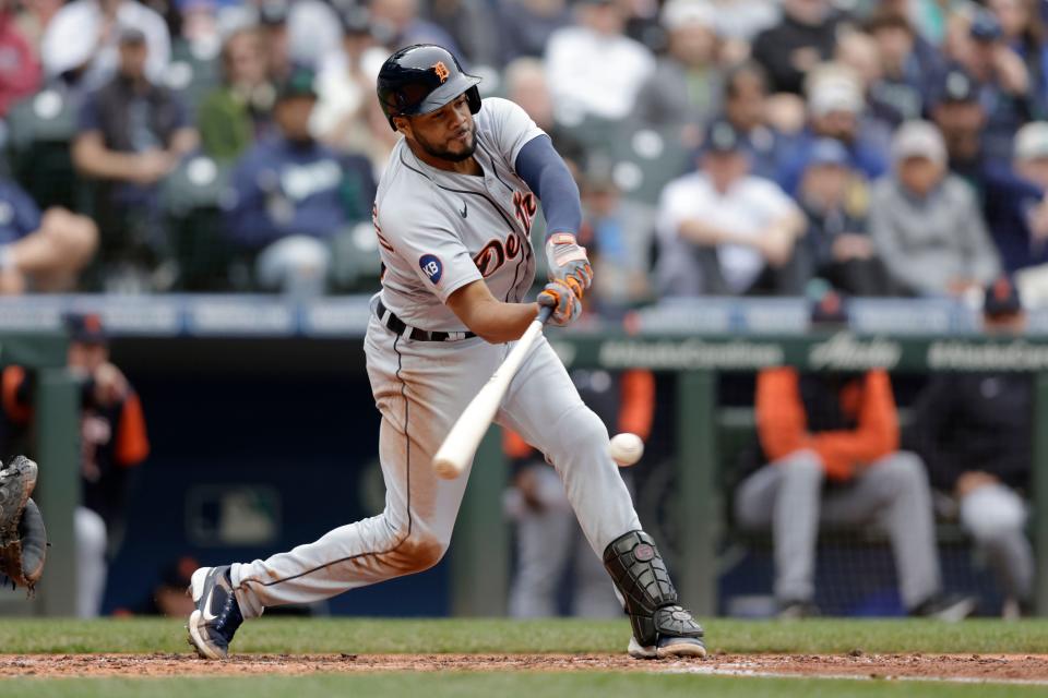 Detroit Tigers' Jeimer Candelario hits a single that scored two runs due to a throwing error against the Seattle Mariners during the fourth inning a baseball game, Wednesday, Oct. 5, 2022, in Seattle.