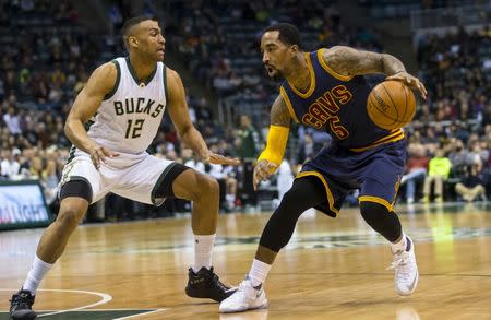 Apr 5, 2016; Milwaukee, WI, USA; Cleveland Cavaliers guard J.R. Smith (5) drives for the basket as Milwaukee Bucks forward Jabari Parker (12) defends during the first quarter at BMO Harris Bradley Center. Mandatory Credit: Jeff Hanisch-USA TODAY Sports / Reuters Picture Supplied by Action Images