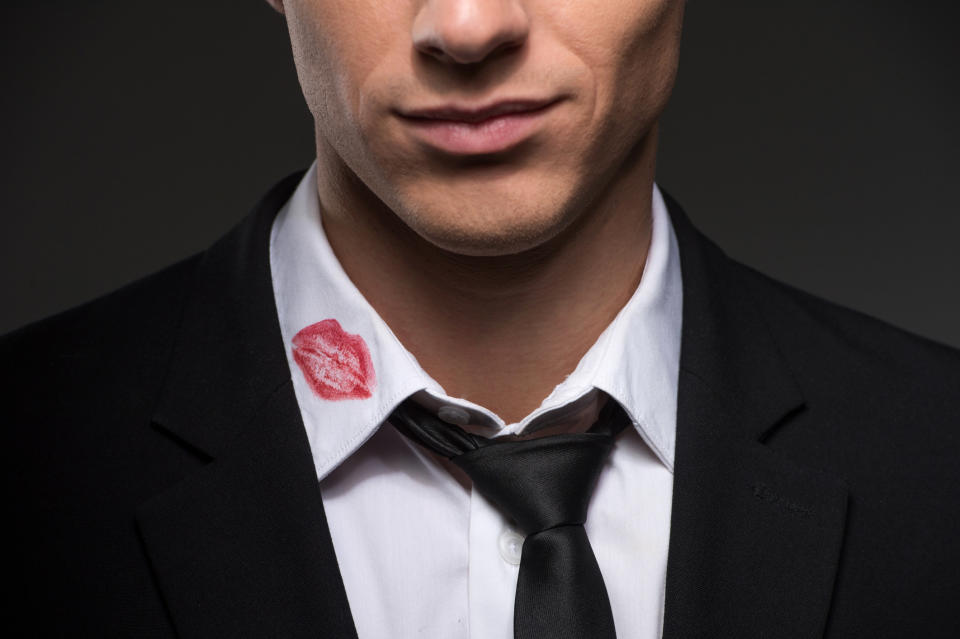 A man with a lipstick print on his collar