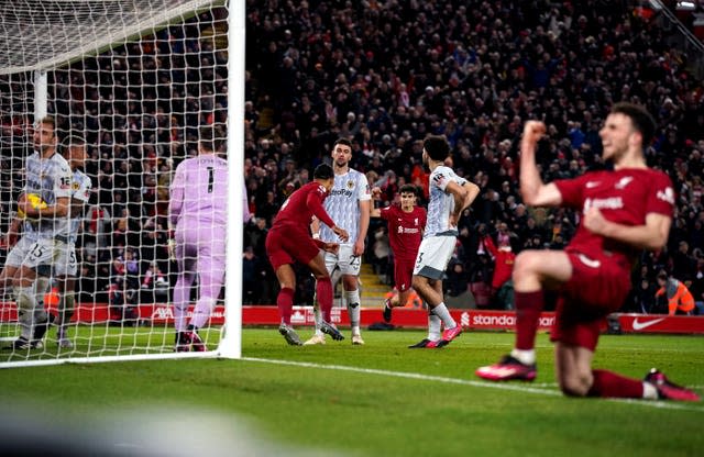 Virgil van Dijk turns to celebrate scoring the opening goal