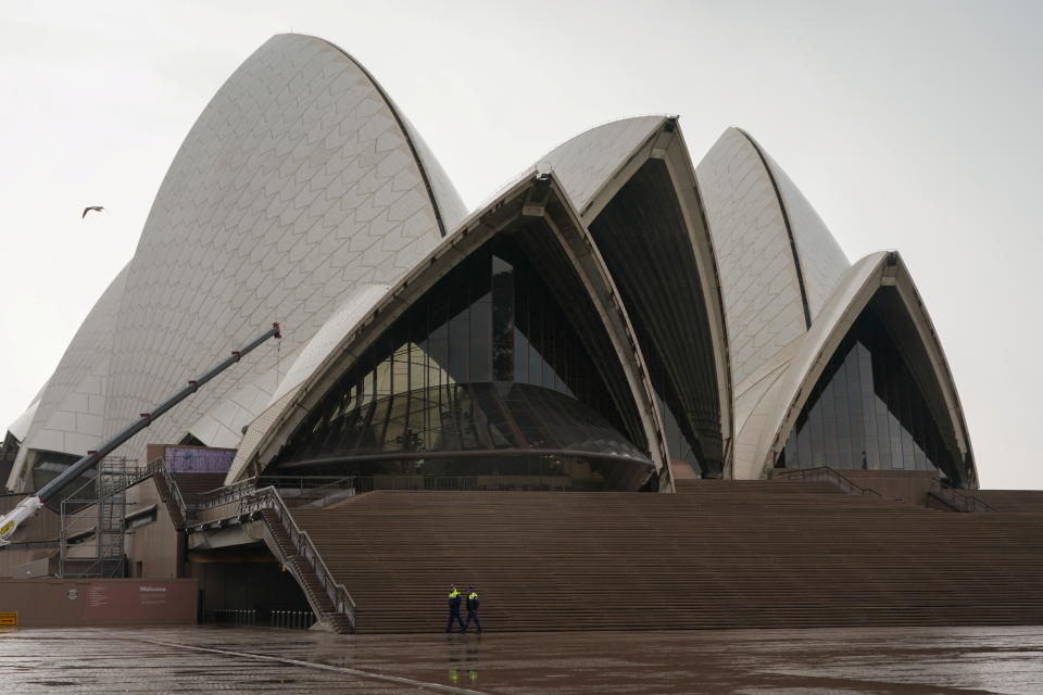 Police officers patrol the empty steps of the Sydney Opera House during a lockdown to curb the spread of a coronavirus disease (COVID-19) outbreak in Sydney, Australia, June 29, 2021. REUTERS/Loren Elliott