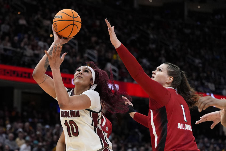 South Carolina center Kamilla Cardoso (10) shoots over North Carolina State center River Baldwin (1) during the first half of a Final Four college basketball game in the women's NCAA Tournament, Friday, April 5, 2024, in Cleveland. (AP Photo/Morry Gash)
