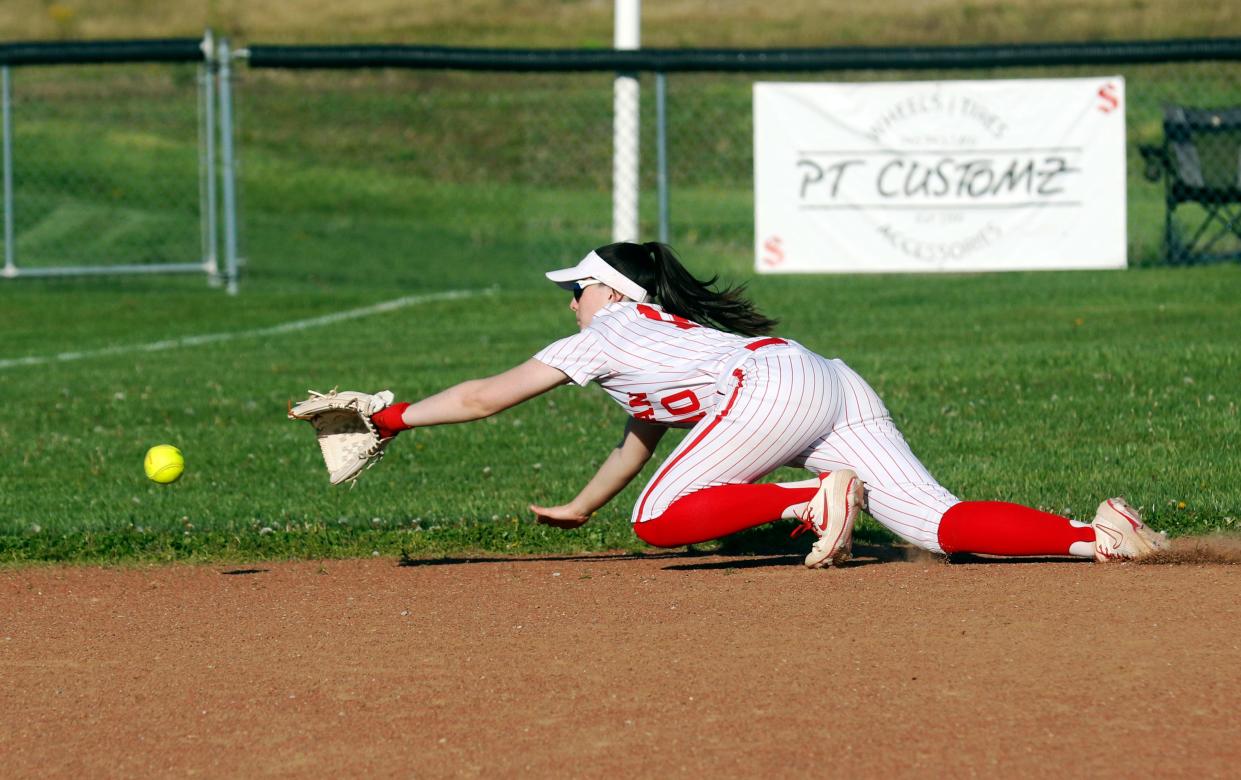 Payton Powell dives for a ground ball during Sheridan's 5-2 win against visiting Tri-Valley on Monday in Thornville.