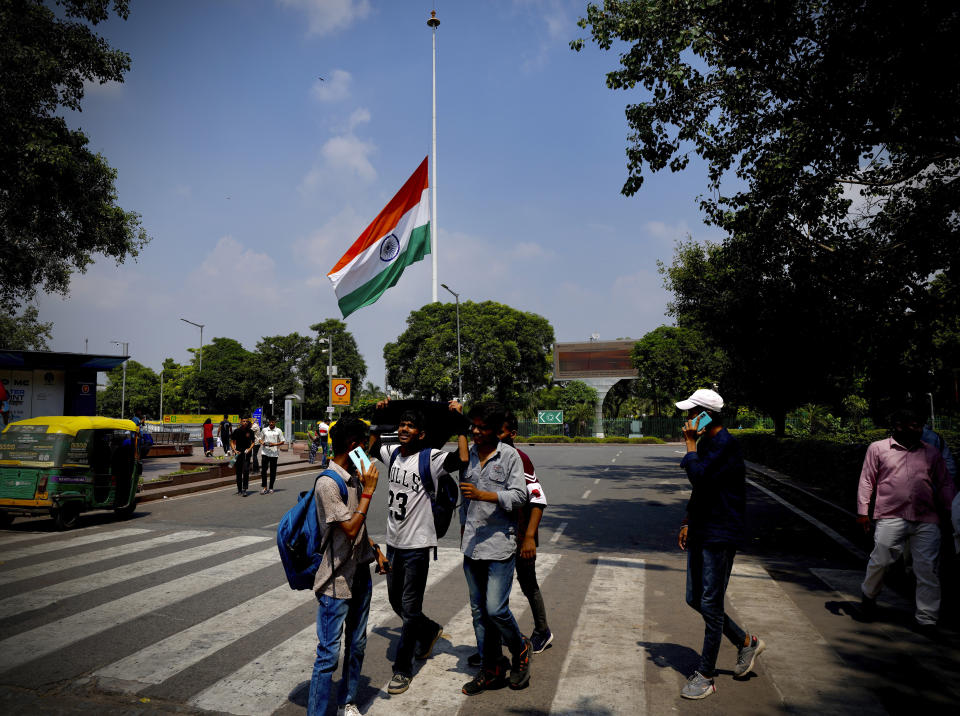 The Indian flag flies at half-mast at the Central Park in Connaught Place following Thursday’s death of Britain's Queen Elizabeth II in New Delhi, India, Sunday, Sept.11, 2022. (AP Photo/Manish Swarup)