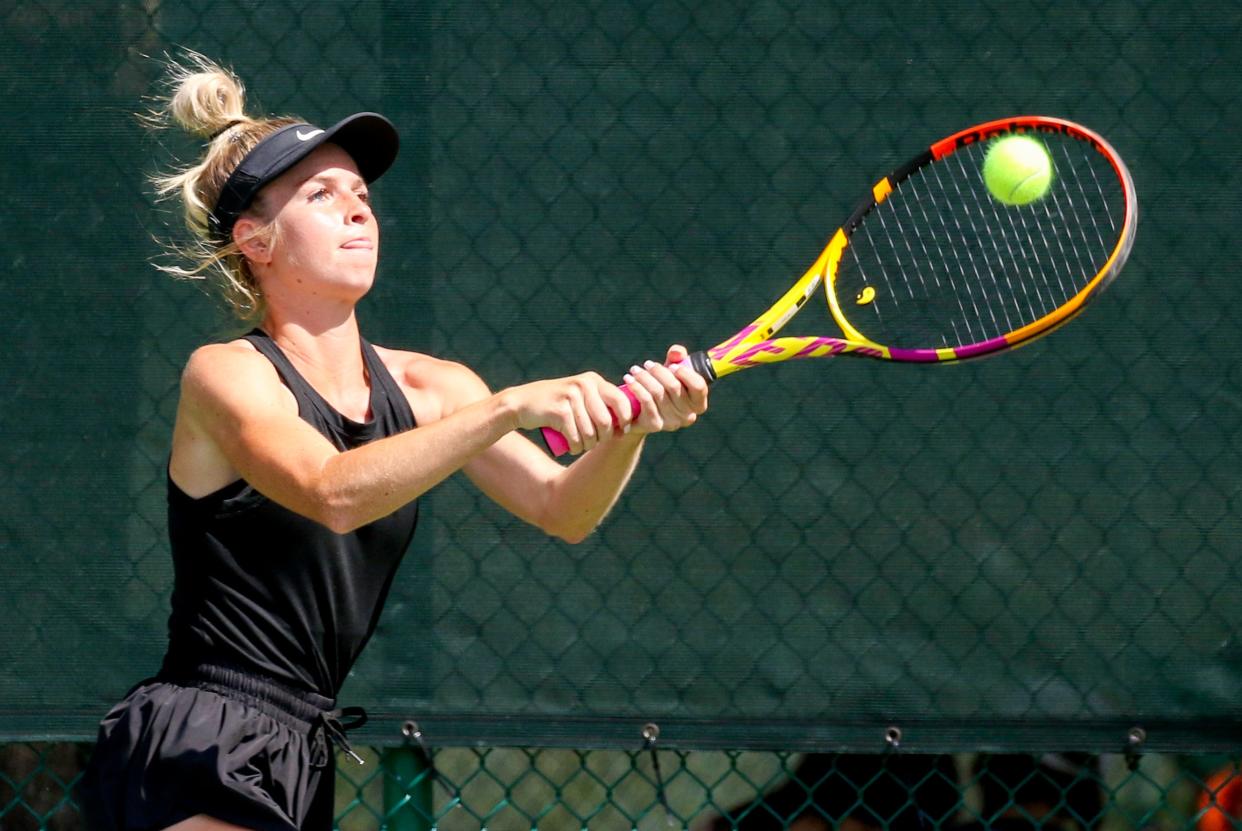 Auburndale's Peyton Battilla hits a backhand shot during her No. 1 doubles match against St. Petersburg on Monday in the Class 3A girls tennis state tournament at Sanlando Park in Altamonte Springs.