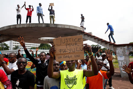 FILE PHOTO: Supporters of Martin Fayulu, runner-up in Democratic Republic of Congo's presidential election, protest in front of the constitutional court as they wait for him to deliver his appeal contesting Congo's National Independent Electoral Commission (CENI) results of the presidential election in Kinshasa, Democratic Republic of Congo, January 12, 2019. REUTERS/Baz Ratner/File Photo