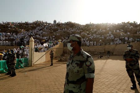 Saudi security officers secure as Muslim pilgrims gather on Mount Mercy on the plains of Arafat during the annual haj pilgrimage, outside the holy city of Mecca, Saudi Arabia August 20, 2018. REUTERS/Zohra Bensemra