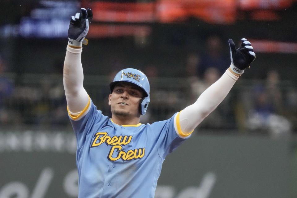 Milwaukee Brewers' Luis Urias reacts after hitting an RBI double during the second inning of a baseball game against the Oakland Athletics Friday, June 9, 2023, in Milwaukee. (AP Photo/Morry Gash)