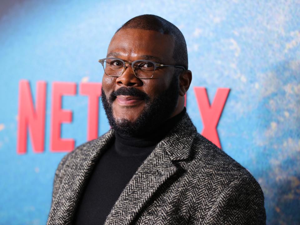 Tyler Perry in a gery jacket and black turtleneck