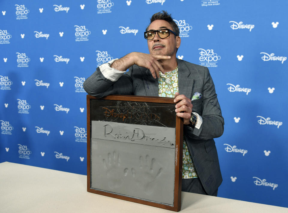 Actor Robert Downey Jr. poses during his handprint ceremony at the Disney Legends press line during the 2019 D23 Expo, Friday, Aug. 23, 2019, in Anaheim, Calif. (Photo by Chris Pizzello/Invision/AP)