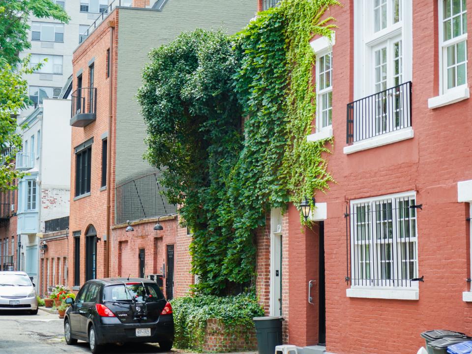 A line of red brick houses.