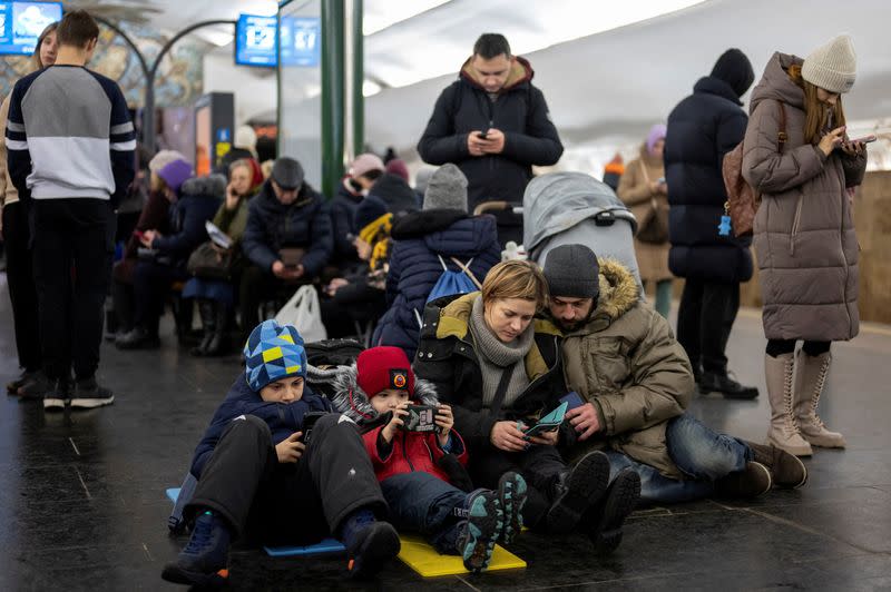 People take shelter inside the metro station during Russian missile attacks in Kyiv