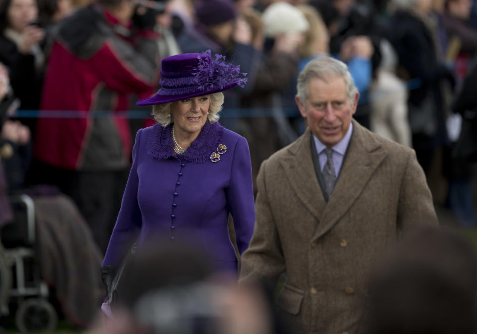 Britain's Prince Charles and his wife Camilla the Duchess of Cornwall arrive for the British royal family's traditional Christmas Day church service in Sandringham, England, Tuesday, Dec. 25, 2012. (AP Photo/Matt Dunham)