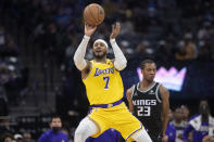 Los Angeles Lakers forward Carmelo Anthony (7) shoots against the Sacramento Kings during the first quarter of an NBA basketball game in Sacramento, Calif., Tuesday, Nov. 30, 2021. (AP Photo/Randall Benton)