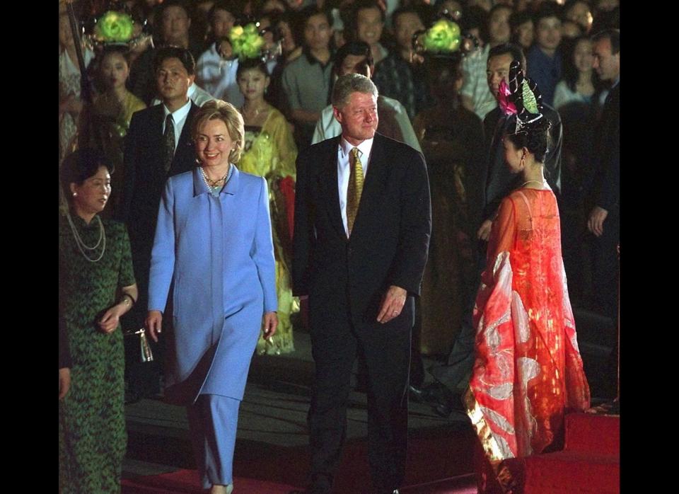 President Clinton and first lady Hillary Rodham Clinton are escorted to the city gate of the ancient city of Xi'an after their arrival in China June 25, 1998. 