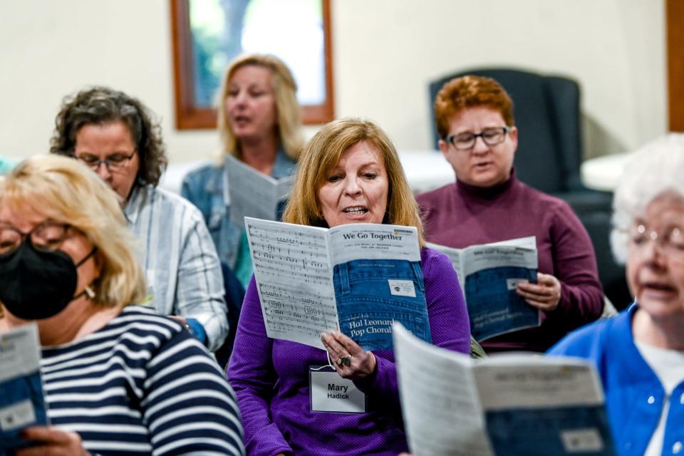 Delta Community Choir member Mary Hadick, center, sings during a practice on Monday, April 24, 2023, at St. David's Episcopal Church in Lansing.