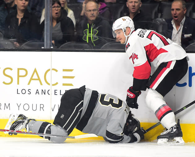 LOS ANGELES, CA - DECEMBER 10: Mark Borowiecki #74 of the Ottawa Senators checks Tyler Toffoli #73 of the Los Angeles Kings into the boards for a boarding penalty during the first period at Staples Center on December 10, 2016 in Los Angeles, California. (Photo by Harry How/Getty Images)