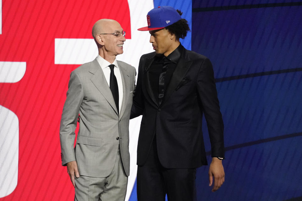 NBA Commissioner Adam Silver greets Cade Cunningham who was picked as the number one overall pick by the Detroit Pistons during the NBA basketball draft, Thursday, July 29, 2021, in New York. (AP Photo/Corey Sipkin)