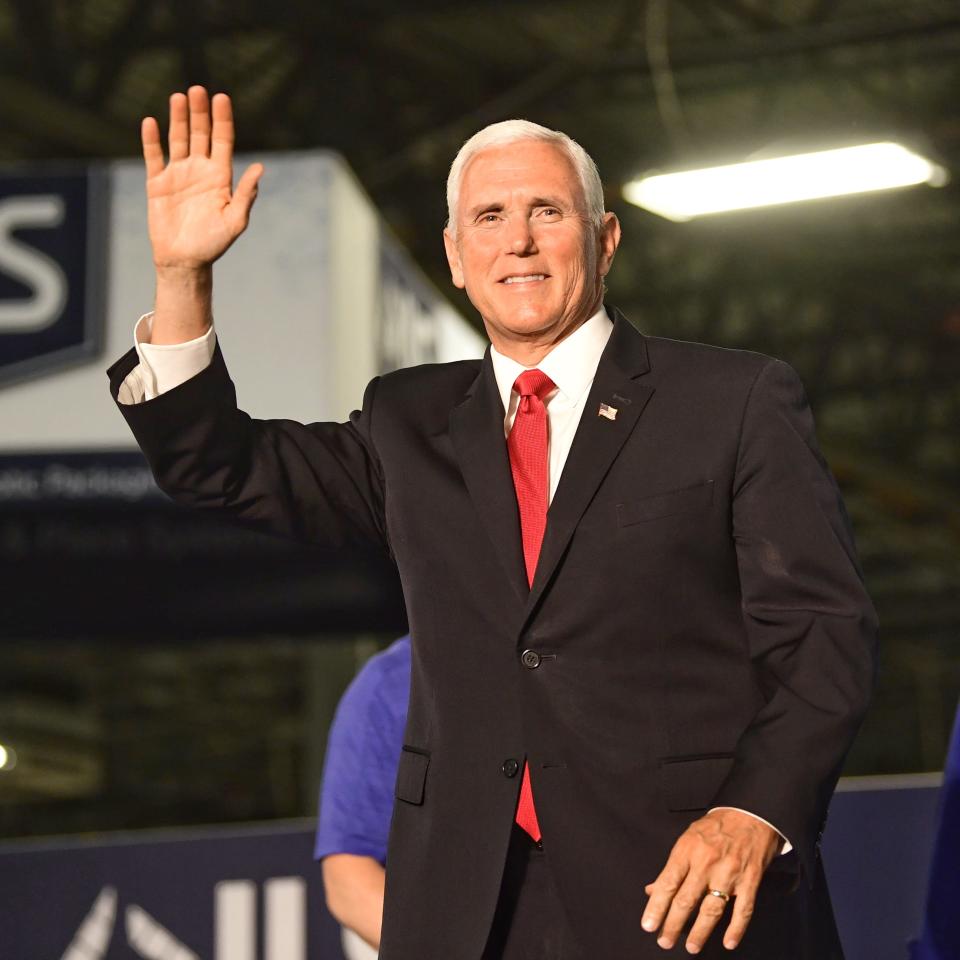 Vice President Mike Pence waves to the crowd as he approaches the podium at JLS Automation in Springettsbury Township to talk about the president’s proposed trade plans, June 6, 2019.