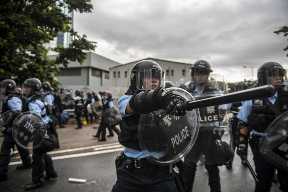 Police Officers are seen waving their batons in Hong Kong, China. 1 July 2019. Protesters today clash with police with police using pepper spray and  batons to disperses Protesters , protesters started occupying road early morning on the 22th anniversary of the handover of Hong Kong From the United Kingdom to China. (Photo by Vernon Yuen/NurPhoto via Getty Images)