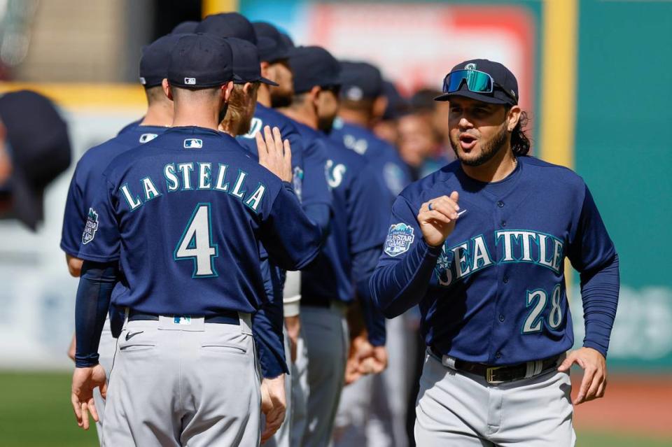 Seattle Mariners third baseman Eugenio Suarez (28) gets introduced before a baseball game against the Cleveland Guardians, Friday, April 7, 2023, in Cleveland. (AP Photo/Ron Schwane)