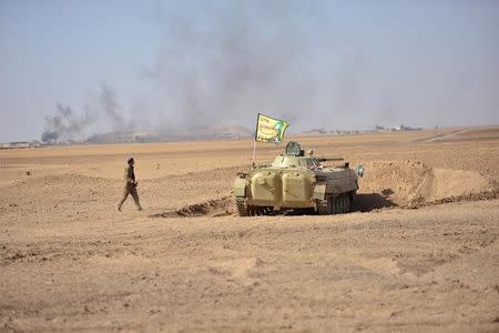 Popular Mobilization Forces (PMF) take part in an operation against Islamic State militants on the outskirts of the town of Hammam Al-Alil, south of Mosul, Iraq October 31, 2016. REUTERS/Stringer