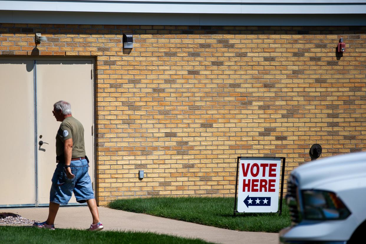 Voters enter their polling locations as Michigan votes in the August 2022 primary election Tuesday, Aug. 2, 2022, at Rose Park Reformed Church in Holland. 