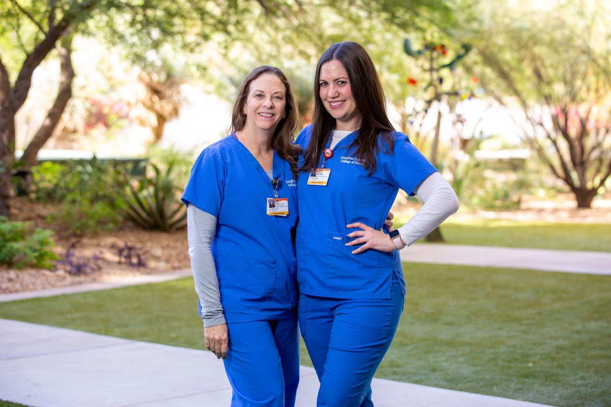 Gloria Gosselin, left, and Chelsea Boudreaux, pictured at Creighton University’s Phoenix campus, exited careers in teaching and public relations in order to become nurses.