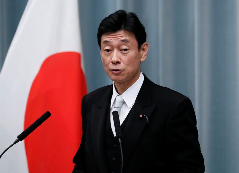 FILE PHOTO: Japan's Economy Minister Nishimura attends a news conference at PM Abe's official residence in Tokyo