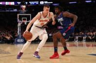 Nov 20, 2017; New York, NY, USA; New York Knicks forward Kristaps Porzingis (6) drives around LA Clippers center DeAndre Jordan (6) during the third quarter at Madison Square Garden. Anthony Gruppuso-USA TODAY Sports