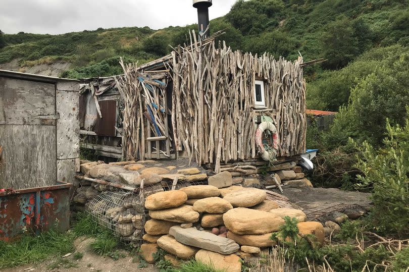 The huts are put together using items found on the shore