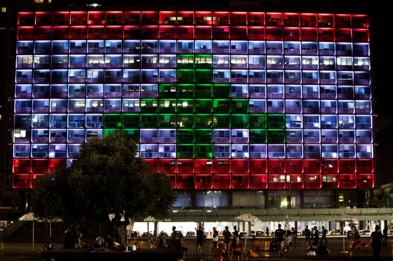 The municipality building is lit in the colours of the Lebanese flag in Tel Aviv