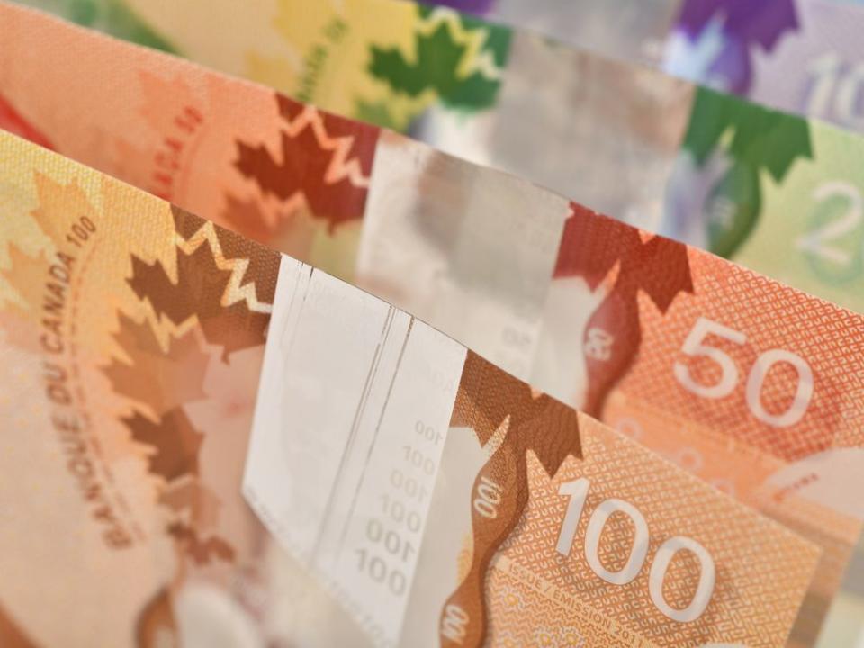 Close up of Canadian banknotes (CAD) background